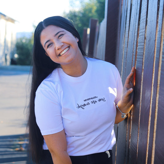 Premium quality tee with our brand "NEVERTHELESS" and "you are enough" intentionally reversed embroidered design to encourage self validation and positive self-care.