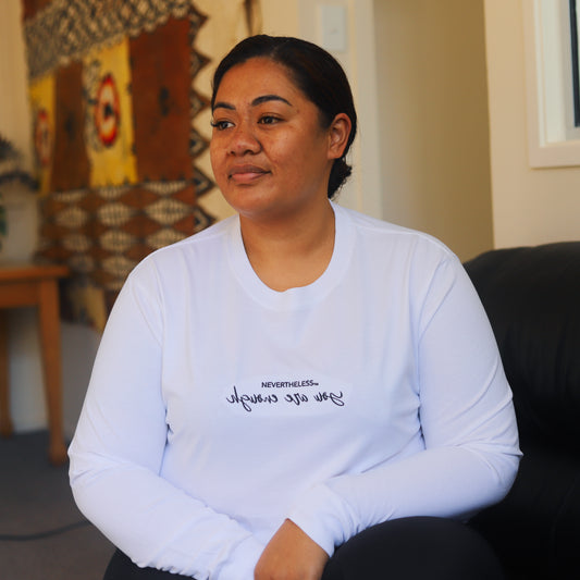 Black and white embroidered Mental Health long sleeve shirt with white and black stitching. The words are intentionally reversed to encourage validation from within and positive self love. Can be read in a mirror.